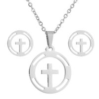 Set collar y aretes cruz plateado