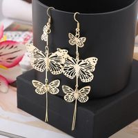 Aretes largos mariposas doradas - copy
