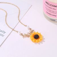 Collar de girasol oro rosa