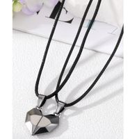 Collar doble corazón negro con imán para parejas o mejores amigos