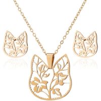 Set collar y aretes gato y flores dorado