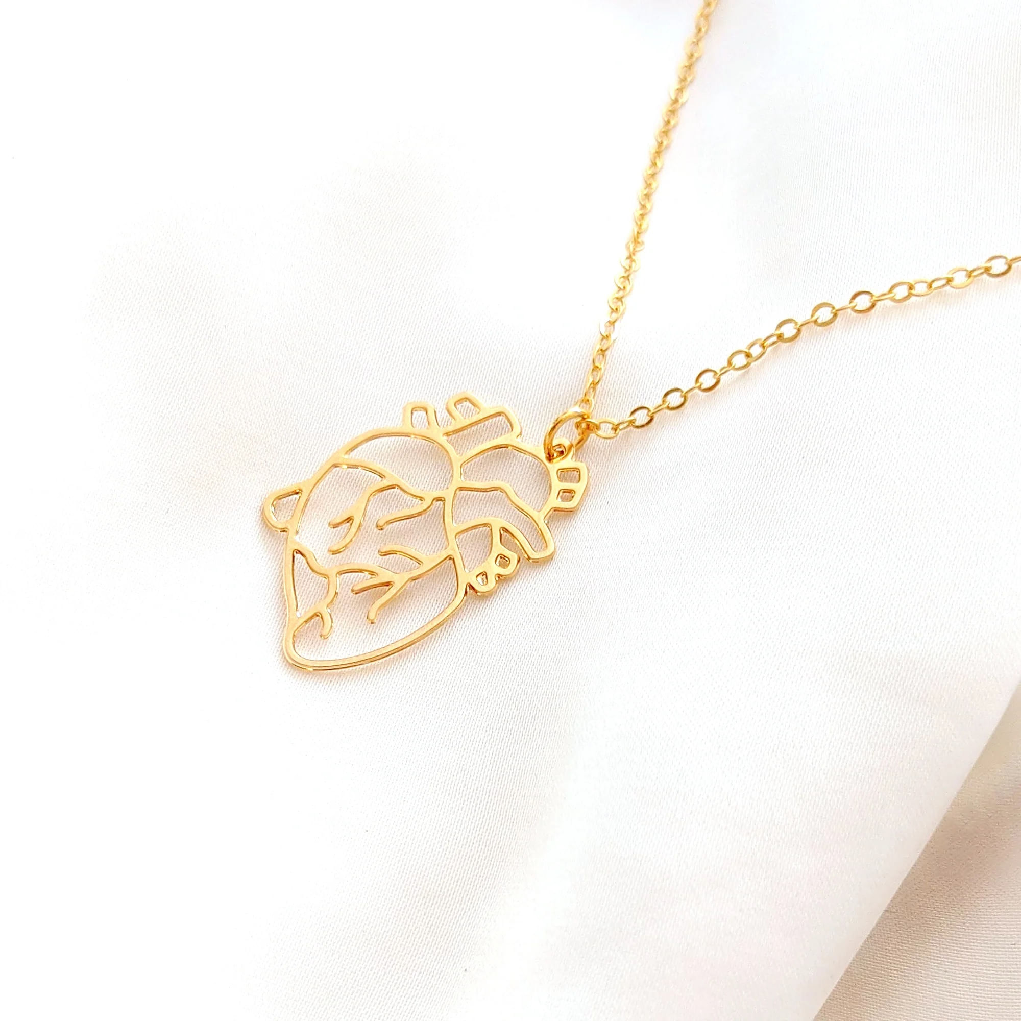Collar corazón anatómico medicina unisex dorado