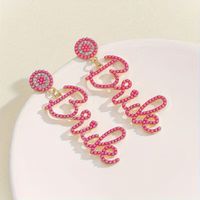 Aretes bride para la novia despedida de soltera fucsia