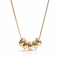 COLLAR CON CUENTAS OVALADAS DORADO
