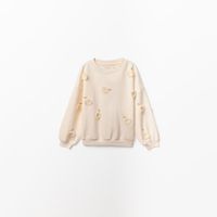 Polera Niña Sfera Manzanas Flecos Crudo